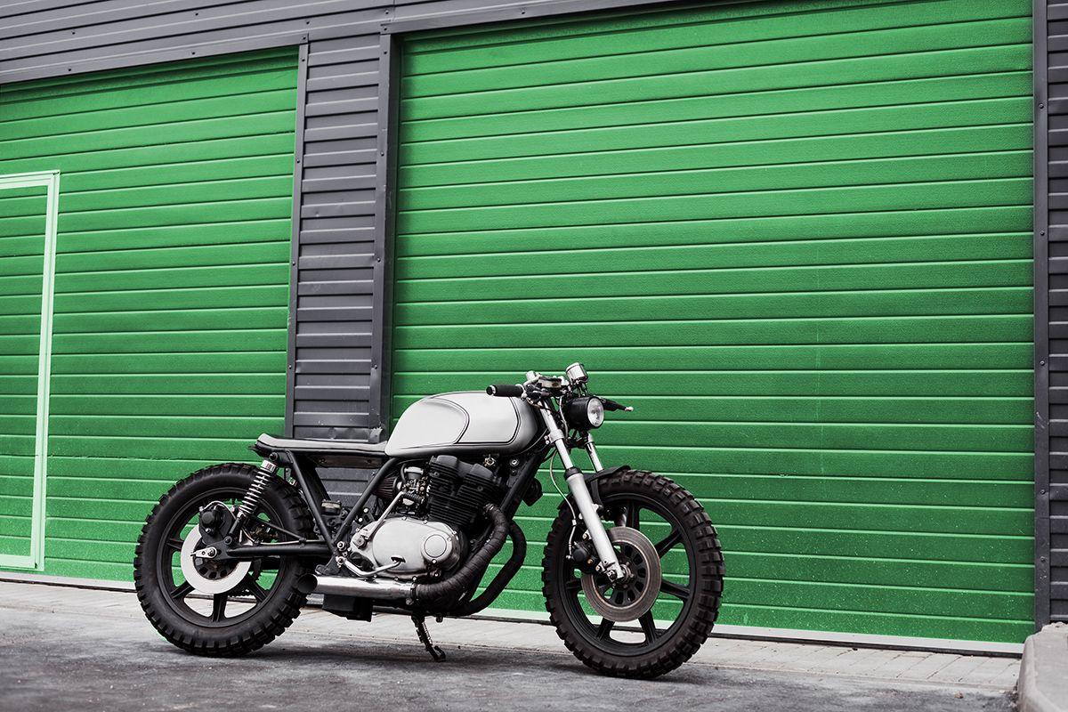 Motorcycle in front of Green Storage Unit